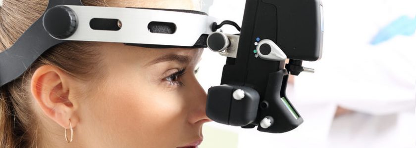 45679034 - an eye exam at an ophthalmologist, ophthalmoscope